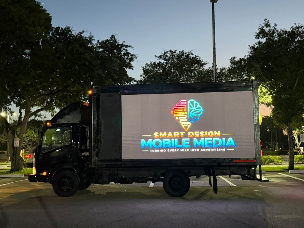 Smart Design Mobile Media LED billboard truck lit at dusk